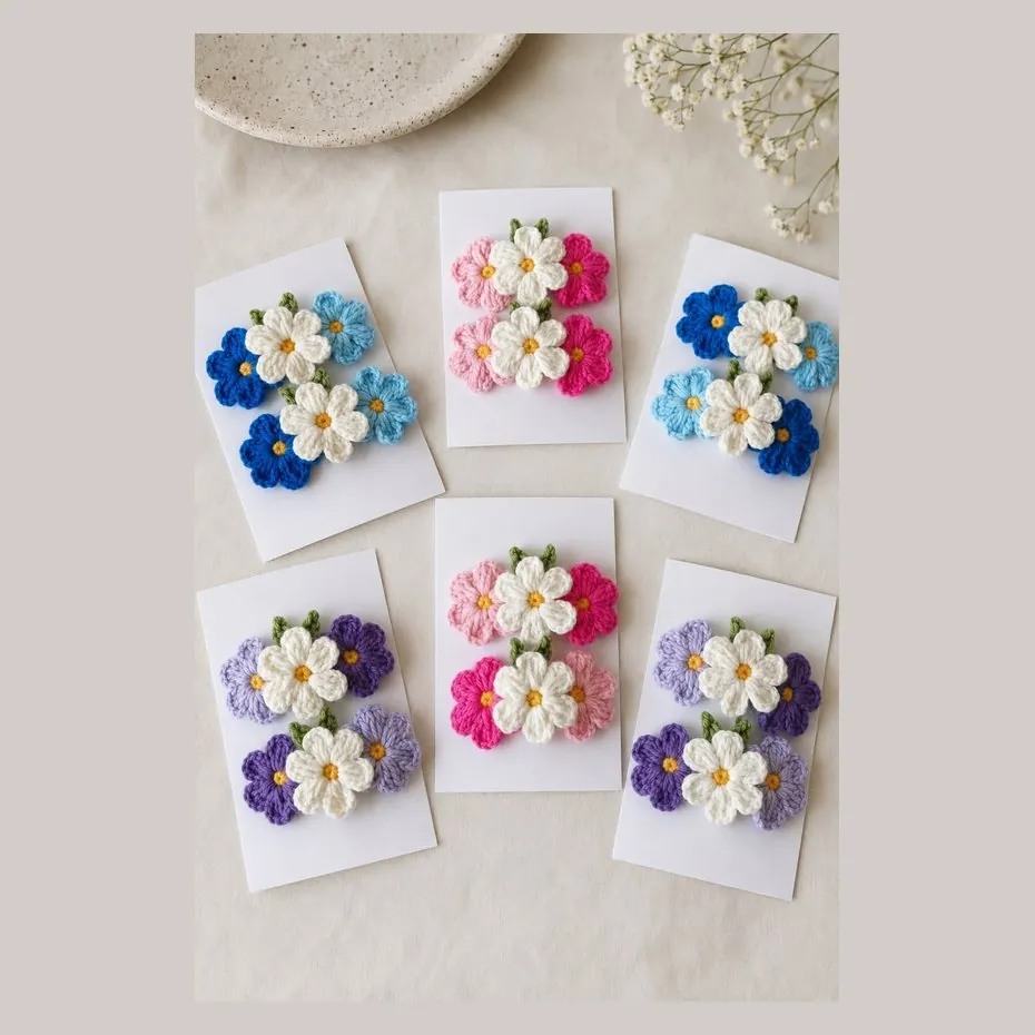 Handmade crochet hair pins with a cluster of three flowers, in six colourways