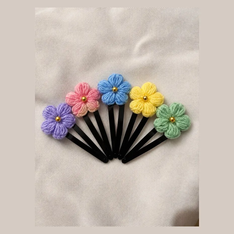 Handmade crochet puff flower hair pins with gold bead centres in five colours