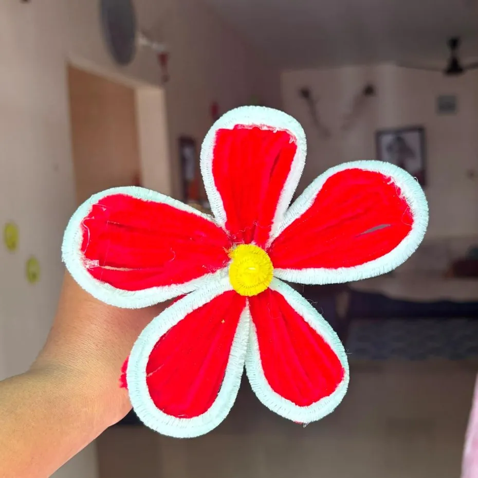 Large handmade red and white daisy flower with yellow centre