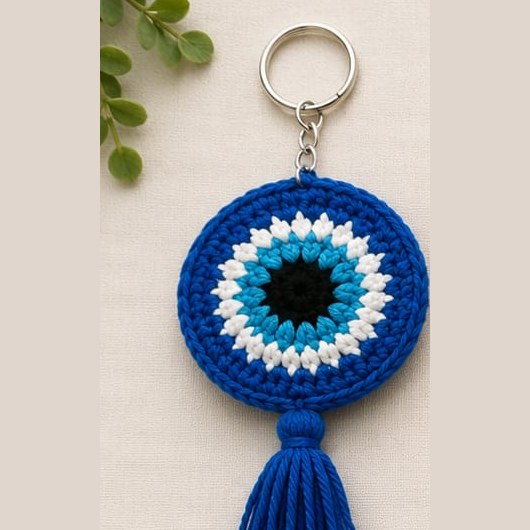 Handmade crochet evil eye keychain with blue tassel