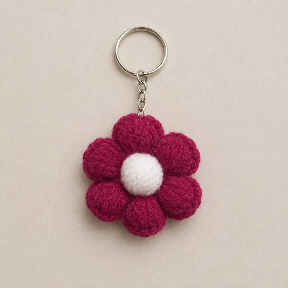 Handmade crochet magenta six-petal puff flower keychain with white centre