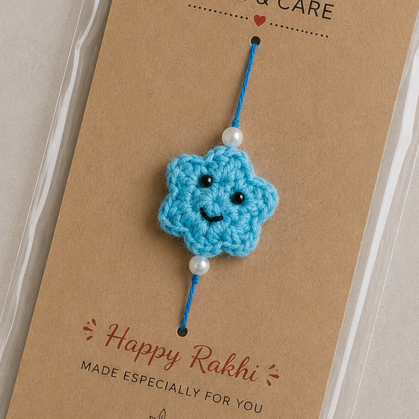 Handmade crochet blue smiley star rakhi with pearl beads on a blue thread