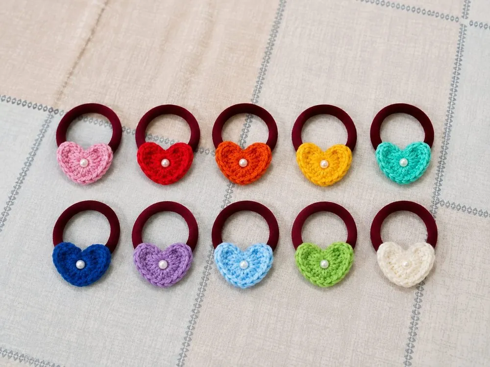 Handmade crochet heart hair ties on soft elastic bands, in ten colours